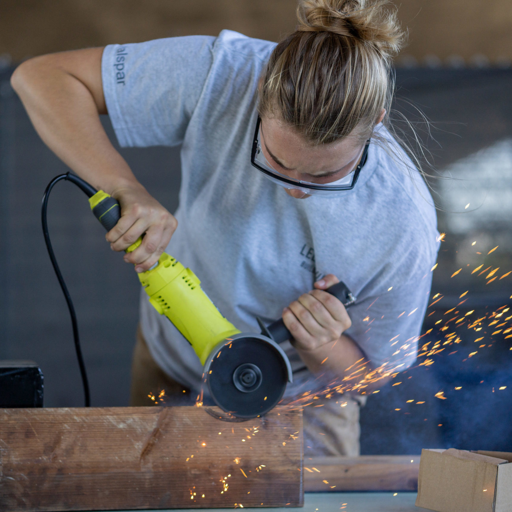 Image of THIMBY volunteer with an angle grinder